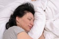 Young woman enjoying a good restful sleep Royalty Free Stock Photo