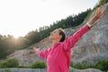 Young woman enjoying life standing outside with spread arms Royalty Free Stock Photo