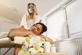 Young woman enjoying massage and relaxing and boosting immune system in times of pandemics