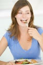 Young Woman Enjoying Meal Royalty Free Stock Photo