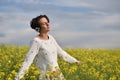 Young woman enjoying music in the headphones in the nature Royalty Free Stock Photo