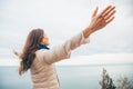 Young woman is enjoying nature with panoramic sea view from a cliff Royalty Free Stock Photo