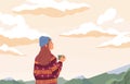 Young woman enjoying peaceful landscape, relaxing, looking at sky with clouds, drinking tea and dreaming. Inspiration