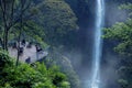 Young woman enjoying Pelangi waterfall scenery Royalty Free Stock Photo