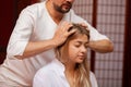 Young woman enjoying professional thai massage