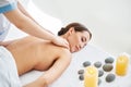 Young woman enjoying relaxing back massage at spa salon Royalty Free Stock Photo