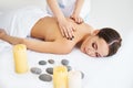 Young woman enjoying relaxing back massage at spa salon Royalty Free Stock Photo