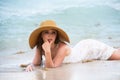 Young woman enjoying summer, laying on beach. Sensual girl sunbathing at sea beach. Summer relax and vacation. Royalty Free Stock Photo