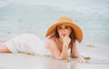 Young woman enjoying summer, laying on beach. Sensual girl sunbathing at sea beach. Summer relax and vacation. Royalty Free Stock Photo