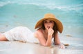 Young woman enjoying summer, laying on beach. Sensual girl sunbathing at sea beach. Summer relax and vacation. Royalty Free Stock Photo