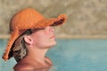 Young woman enjoying the sun in the pool