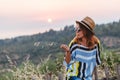 Young woman enjoying sunset by the seaside Royalty Free Stock Photo