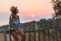 Young woman enjoying sunset by the seaside Royalty Free Stock Photo