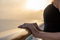 Close up of female hands on a cruise ship during sunset Royalty Free Stock Photo