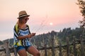 Young woman enjoying sunset by the seaside Royalty Free Stock Photo