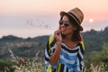 Young woman enjoying sunset view by seaside Royalty Free Stock Photo