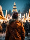 Young woman Enjoying of a traditional Christmas Market and a charming winter holidays