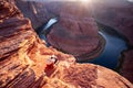 Young woman enjoying view of Horseshoe bend, Arizona. Dusk photo of Horseshoe Bend in Arizona United States of America Royalty Free Stock Photo