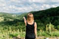 Young woman enjoying the view of a mountain range