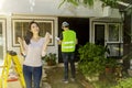 The young woman enjoys renovating the house and preparing the cash with no worries. Royalty Free Stock Photo