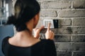 Young woman entering security pin on home alarm keypad Royalty Free Stock Photo