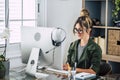 Young woman entrepreneur at work on computer in home office workplace. Modern female people with online smart working job business Royalty Free Stock Photo