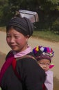 Young woman ethnic black Dao with her baby