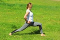 Young woman of European appearance does yoga in summer nature Royalty Free Stock Photo