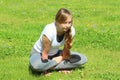 Young woman of European appearance does yoga in summer nature Royalty Free Stock Photo