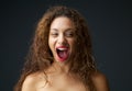 Young woman excited and laughing with open mouth Royalty Free Stock Photo