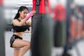 Young woman execute exercise in fitness center. female athlete h Royalty Free Stock Photo