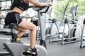 Young woman execute exercise in fitness center. female athlete r Royalty Free Stock Photo