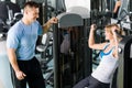 Young woman exercise on shoulder press machine