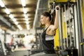 Young woman exercises on an exercise machine at the gym Royalty Free Stock Photo