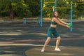 Young woman exercising with a ball on a street ground Royalty Free Stock Photo