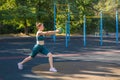 Young woman exercising with a ball on a street ground Royalty Free Stock Photo