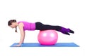 Young woman exercising with fit-ball