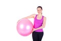 Young woman exercising with fit-ball