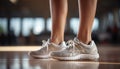 Young woman exercising in gym with sports shoe generated by AI