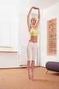 Young Woman Exercising at Home Royalty Free Stock Photo