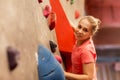 Young woman exercising at indoor climbing gym Royalty Free Stock Photo