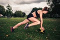 Young woman exercising with medicine ball in park Royalty Free Stock Photo