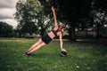 Young woman exercising with medicine ball in park Royalty Free Stock Photo