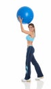 Young woman exercising with a pilates ball