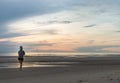 Young woman exercising on the sea beach at sunrise Royalty Free Stock Photo