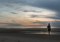 Young woman exercising on the sea beach at sunrise Royalty Free Stock Photo