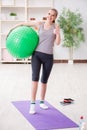 The young woman exercising with stability ball in gym Royalty Free Stock Photo