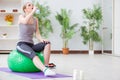 The young woman exercising with stability ball in gym Royalty Free Stock Photo