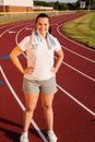 Young woman exercising on a track outdoors Royalty Free Stock Photo