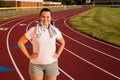 Young woman exercising on a track outdoors Royalty Free Stock Photo